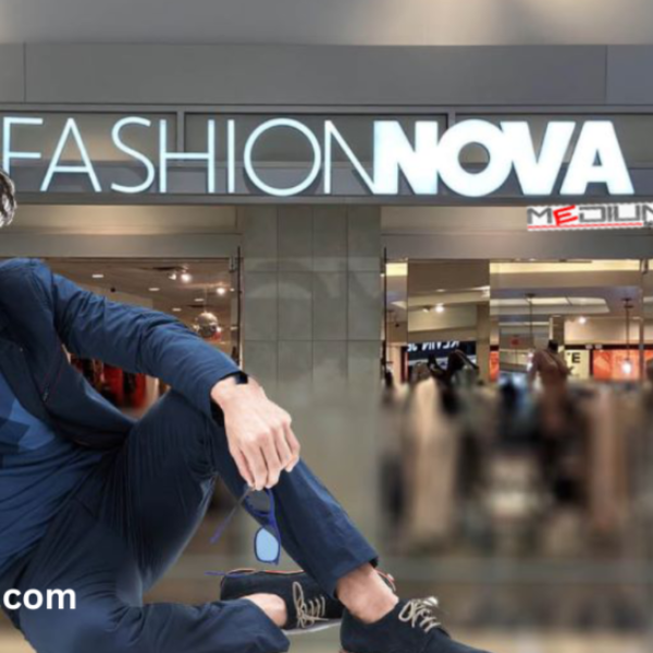 Male model in stylish blue outfit posing in front of a Fashion Nova store.