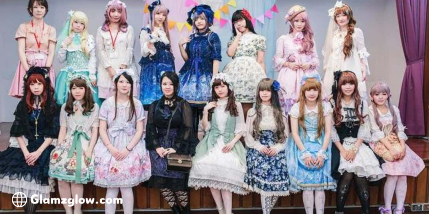 A group of people dressed in elegant and colorful Lolita fashion outfits, posing together.