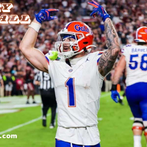 Ricky Pearsall celebrating on the football field during a game, wearing a Florida Gators uniform with number 1.